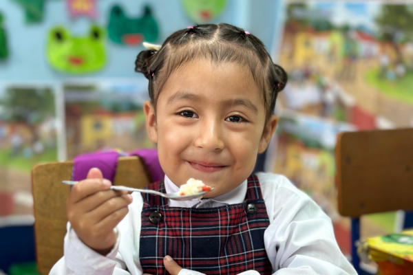 A child eating a school meal